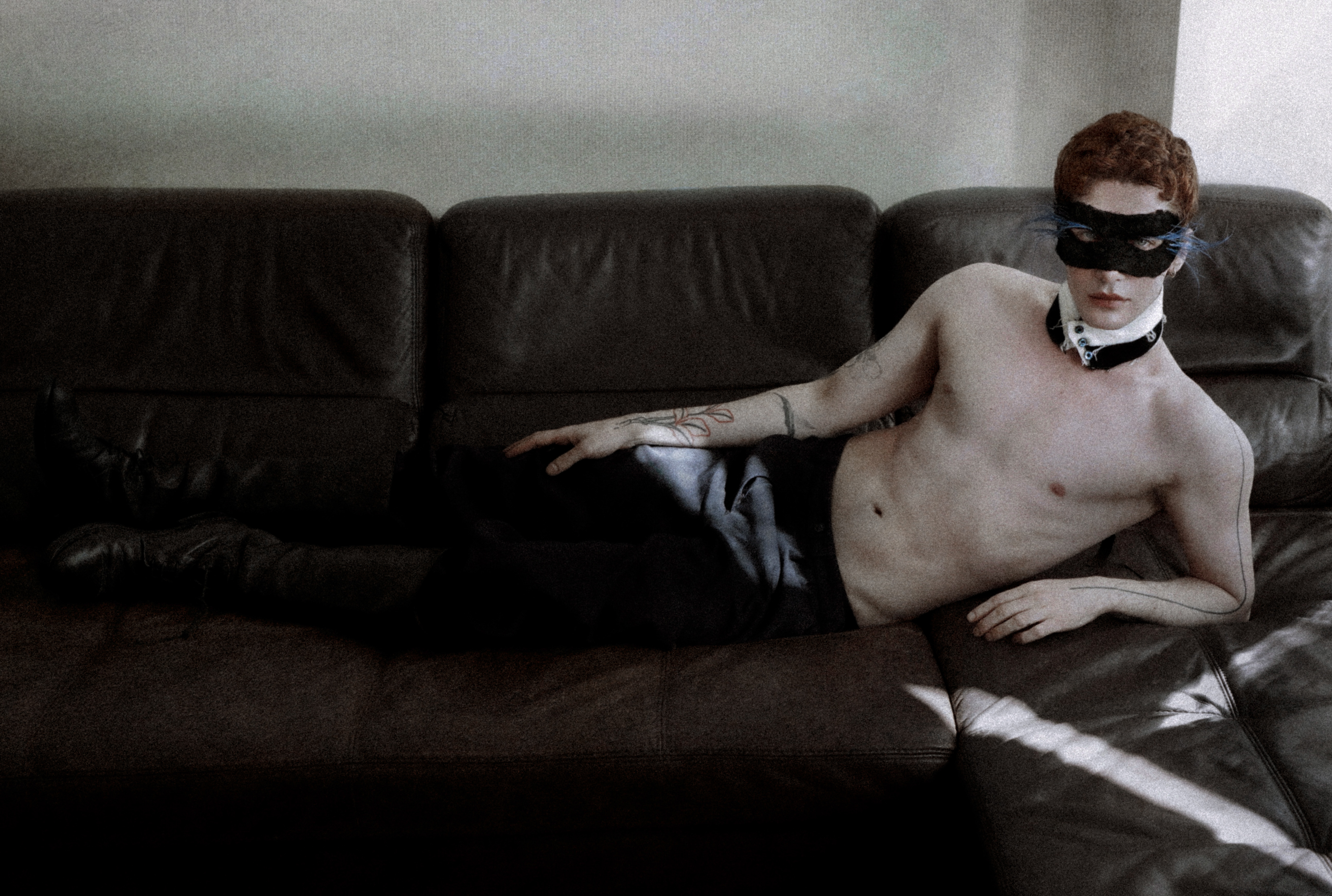 Roman reclining in his own mask and collar